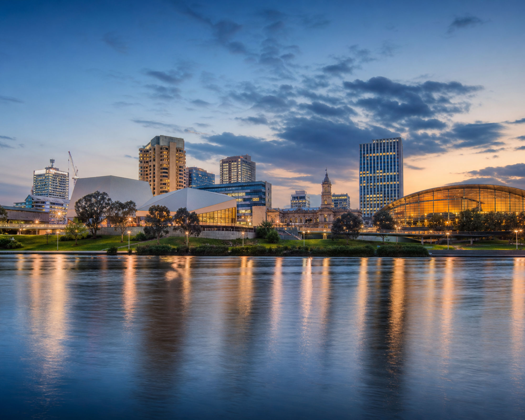 The Adelaide city skyline at dusk, from across the River Torrens